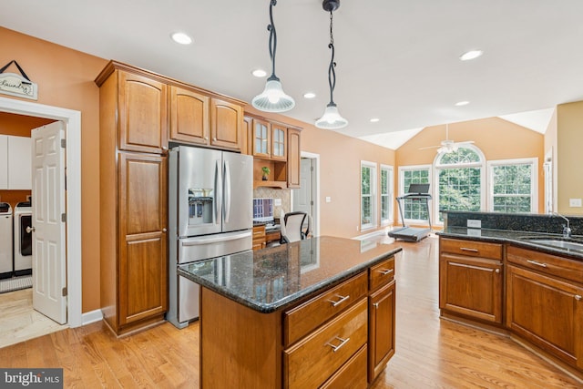 1340 Mountain View Rd, Stafford, VA 22554 - kitchen featuring stainless steel refrigerator with ice dispenser, washing machine and dryer, light wood finished floors, brown cabinetry, and recessed lighting