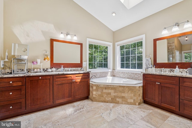 1340 Mountain View Rd, Stafford, VA 22554 - full bath with plenty of natural light, a skylight, two vanities, a bath, and high vaulted ceiling