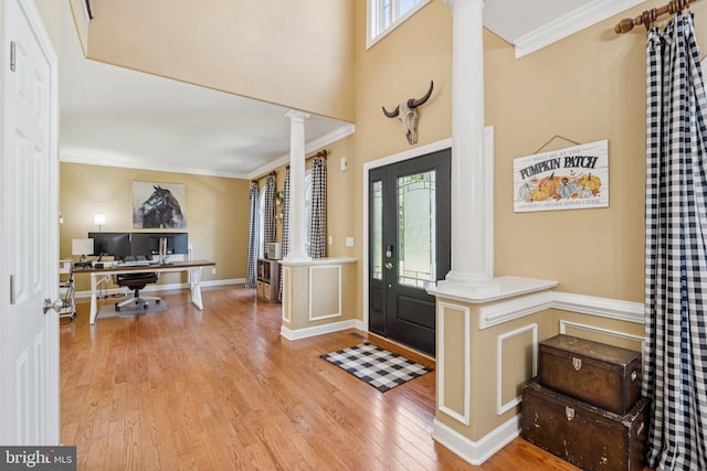 1340 Mountain View Rd, Stafford, VA 22554 - entryway featuring decorative columns, wood finished floors, plenty of natural light, crown molding, and a high ceiling