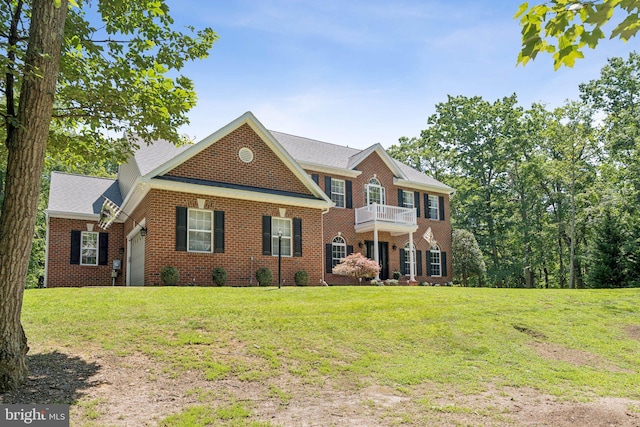 1340 Mountain View Rd, Stafford, VA 22554 - colonial inspired home with brick siding, a front lawn, a balcony, an attached garage, and a shingled roof