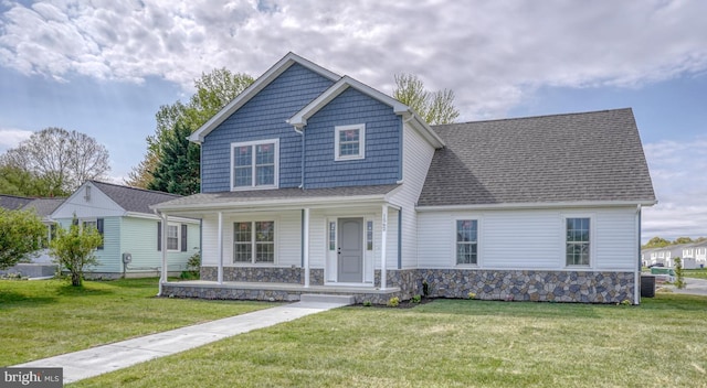 105 Fairfax Ln Unit 84, Dover, DE 19901 - view of front facade featuring a porch, a front yard, stone siding, and a shingled roof
