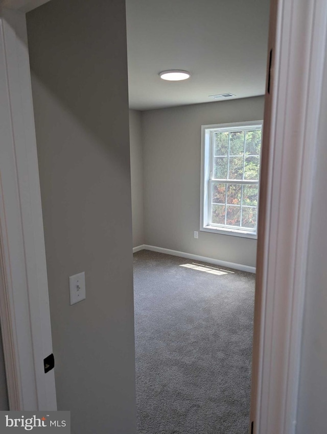 105 Fairfax Ln Unit 84, Dover, DE 19901 - spare room featuring carpet and baseboards