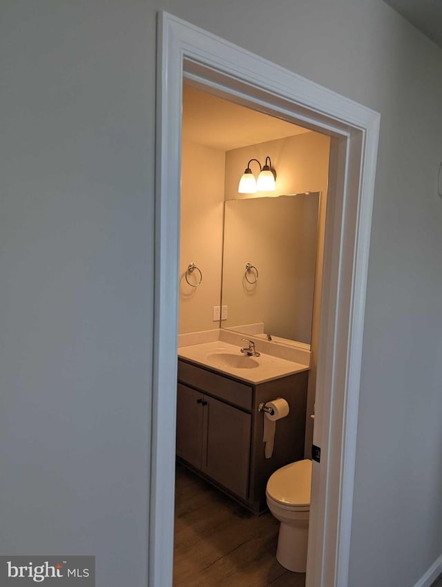105 Fairfax Ln Unit 84, Dover, DE 19901 - bathroom featuring vanity and wood finished floors