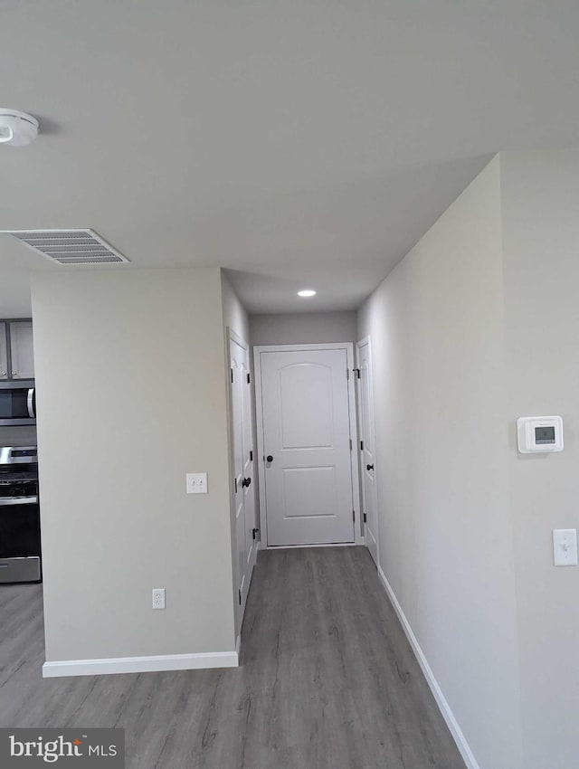 105 Fairfax Ln Unit 84, Dover, DE 19901 - hallway featuring wood finished floors and baseboards