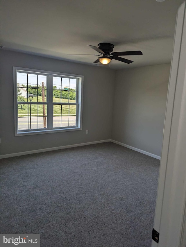 105 Fairfax Ln Unit 84, Dover, DE 19901 - empty room featuring dark carpet and a ceiling fan