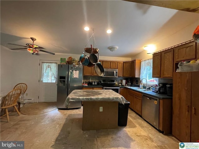 161 Quail Dr, Jim Thorpe, PA 18229 - kitchen featuring appliances with stainless steel finishes, a kitchen island, ceiling fan, dark countertops, and a baseboard radiator