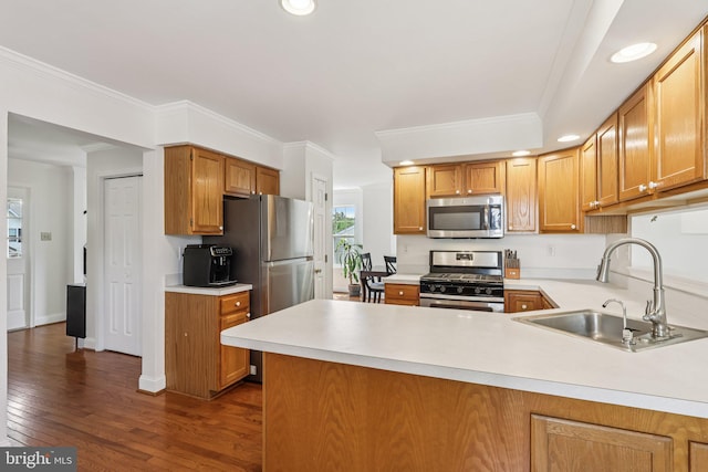 2640 E Colonial Dr, Upper Chichester, PA 19061 - kitchen featuring appliances with stainless steel finishes, light countertops, dark wood-style floors, a peninsula, and recessed lighting