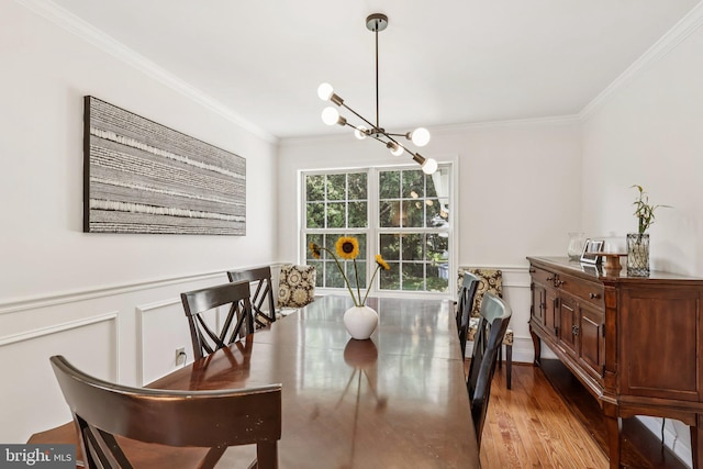 2640 E Colonial Dr, Upper Chichester, PA 19061 - dining area featuring crown molding, a chandelier, wainscoting, and wood finished floors