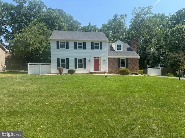 2936 Wynnewood Dr, Vineland, NJ 08361 - colonial house featuring a chimney and brick siding