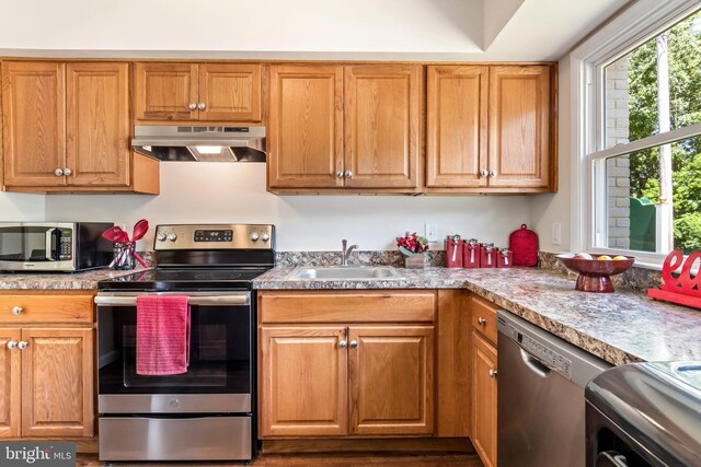 21317 Persimmon Dr, Chestertown, MD 21620 - kitchen with under cabinet range hood, stainless steel appliances, and light countertops