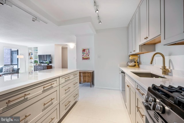 1280 21st St NW Unit 410, Washington, DC 20036 - kitchen featuring light countertops, rail lighting, open floor plan, and stainless steel appliances