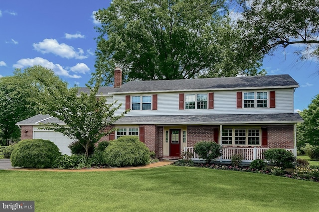 886 Laurel Ln, Harleysville, PA 19438 - traditional-style home featuring covered porch, an attached garage, a chimney, a front lawn, and brick siding