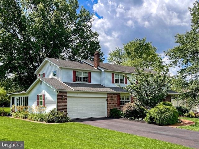 886 Laurel Ln, Harleysville, PA 19438 - view of front of home featuring driveway, a chimney, a front lawn, brick siding, and roof with shingles