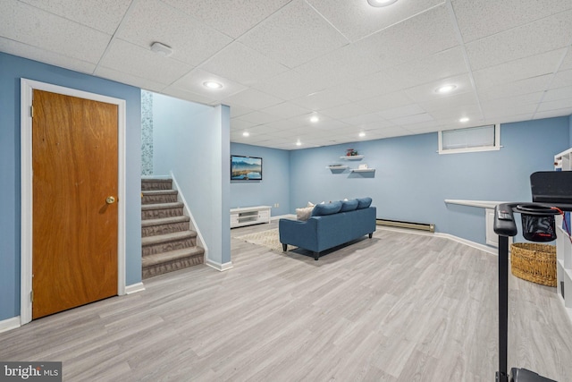 814 Amber Ln, West Chester, PA 19382 - living area with wood finished floors, a baseboard heating unit, a paneled ceiling, stairway, and recessed lighting
