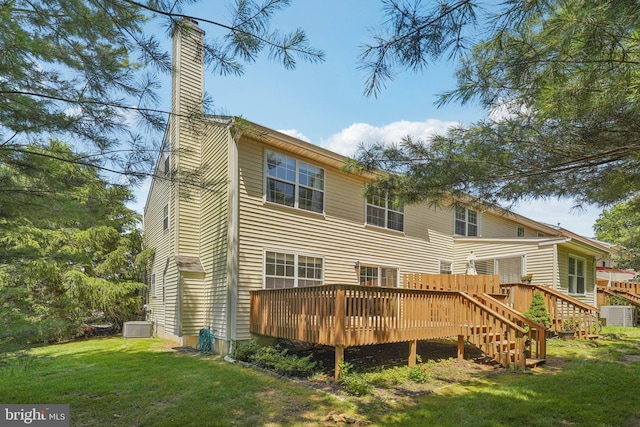 814 Amber Ln, West Chester, PA 19382 - back of property with a chimney, a deck, and a lawn