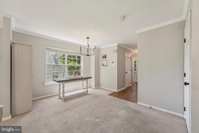 814 Amber Ln, West Chester, PA 19382 - empty room featuring a chandelier, carpet floors, ornamental molding, and a smoke detector