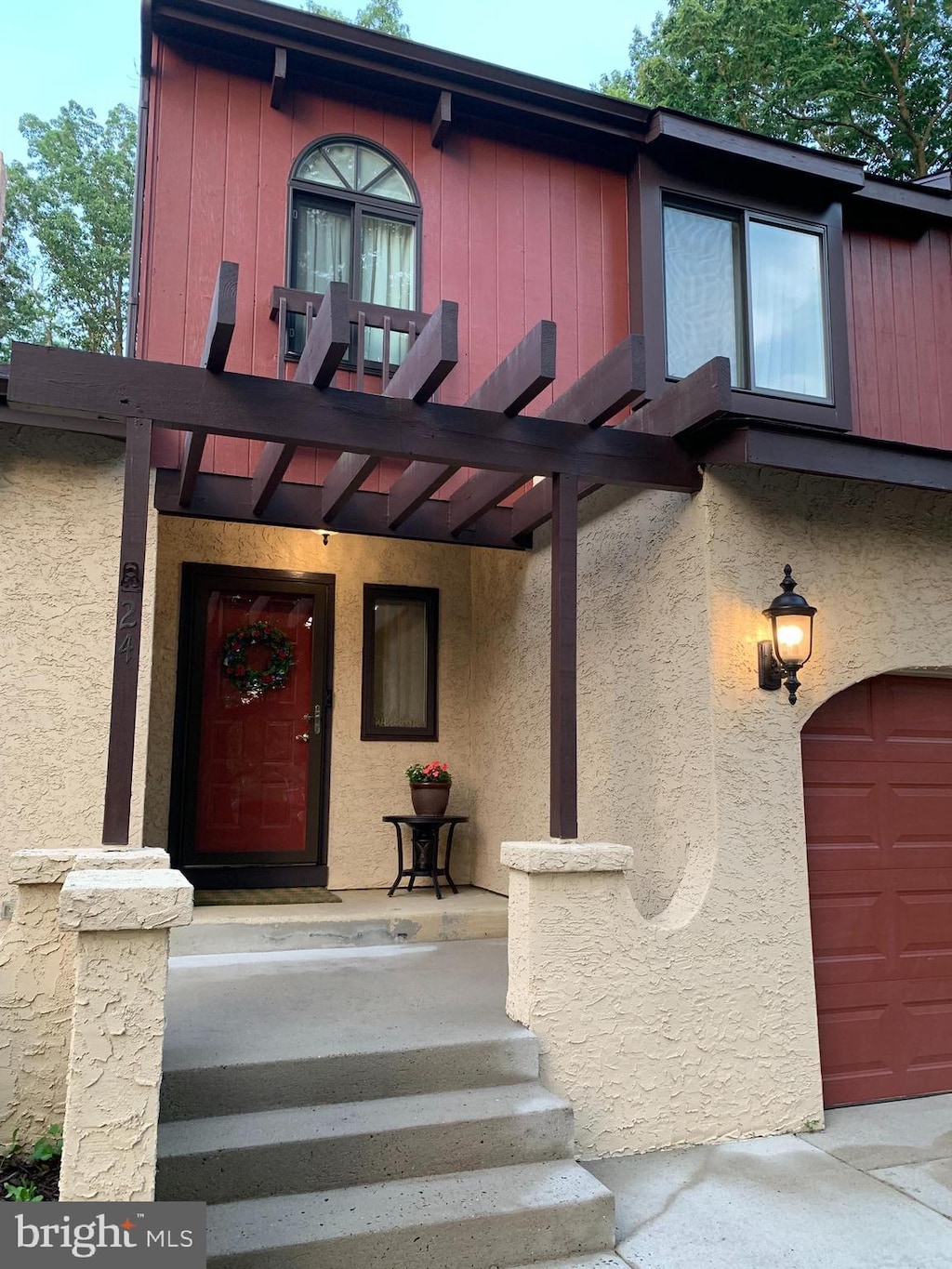 24 Del Sol Pl, Sicklerville, NJ 08081 - property entrance with stucco siding and a garage