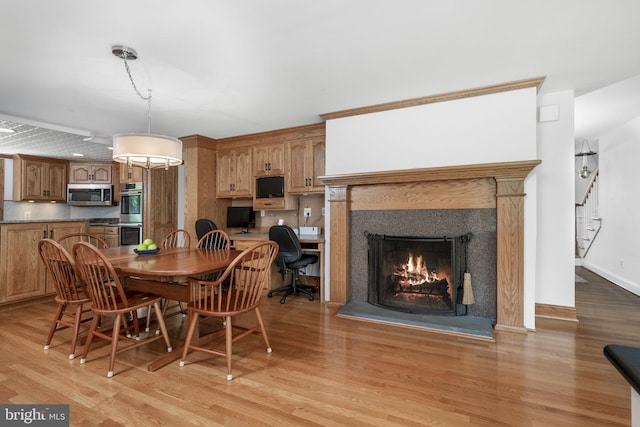 558 Skippack Pike, Blue Bell, PA 19422 - dining room featuring light wood-style floors and a lit fireplace