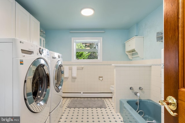558 Skippack Pike, Blue Bell, PA 19422 - laundry room with independent washer and dryer, tile walls, baseboard heating, tile patterned flooring, and a wainscoted wall