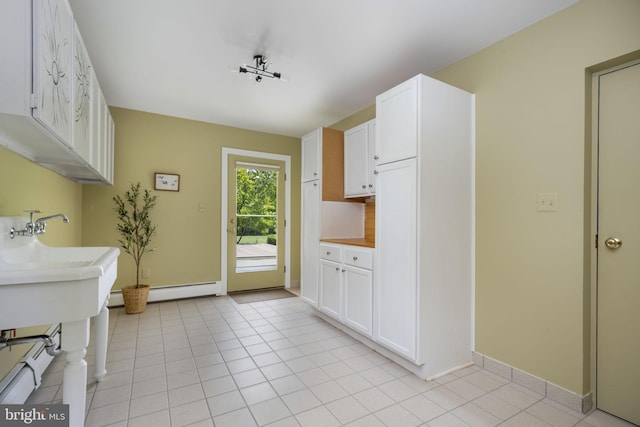 558 Skippack Pike, Blue Bell, PA 19422 - kitchen with white cabinets, light tile patterned flooring, and light countertops