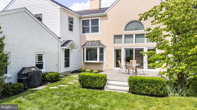 558 Skippack Pike, Blue Bell, PA 19422 - back of property with a lawn, stucco siding, and a chimney