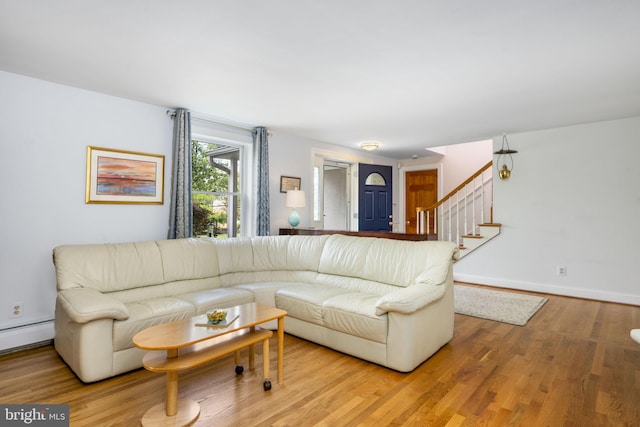 558 Skippack Pike, Blue Bell, PA 19422 - living area featuring wood finished floors, a baseboard heating unit, and stairs