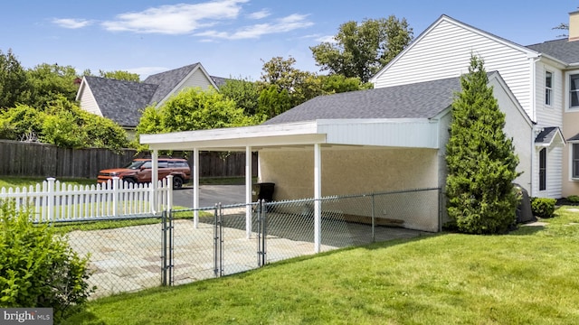 558 Skippack Pike, Blue Bell, PA 19422 - view of side of home with a carport, a shingled roof, and a chimney
