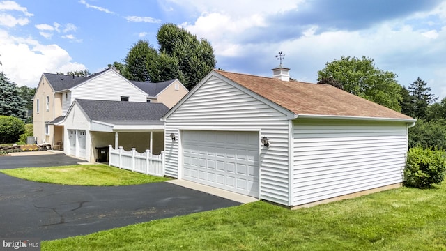 558 Skippack Pike, Blue Bell, PA 19422 - view of front of house featuring a chimney, a shingled roof, a front yard, and an attached garage
