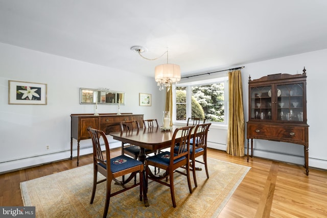 558 Skippack Pike, Blue Bell, PA 19422 - dining area featuring a chandelier, light wood finished floors, and a baseboard radiator