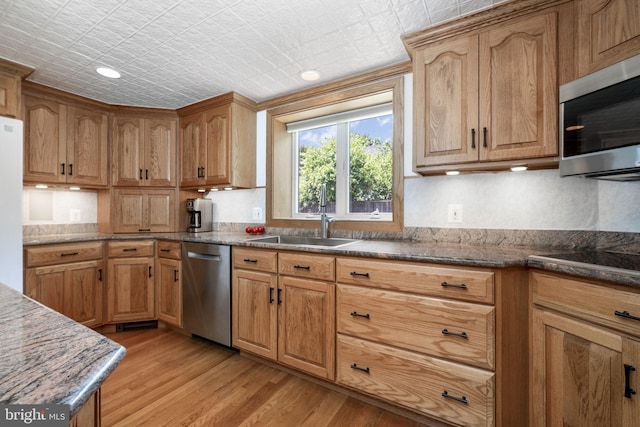 558 Skippack Pike, Blue Bell, PA 19422 - kitchen with stainless steel appliances, light wood-type flooring, recessed lighting, dark stone counters, and an ornate ceiling
