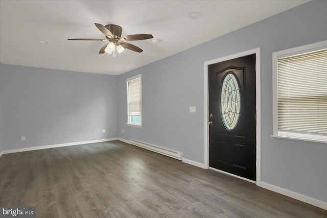 829-831 W Pine St, Coal Township, PA 17866 - foyer entrance featuring a baseboard heating unit, ceiling fan, and dark wood-type flooring