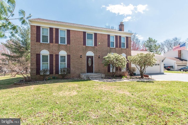 6305 Oklahoma Rd, Eldersburg, MD 21784 - colonial-style house with concrete driveway, a garage, a chimney, and a front yard