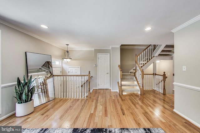 9009 Marie Ct, Lorton, VA 22079 - foyer entrance featuring light wood finished floors, ornamental molding, recessed lighting, a chandelier, and stairway