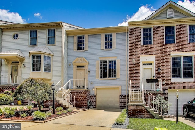 9009 Marie Ct, Lorton, VA 22079 - multi unit property featuring an attached garage, driveway, and brick siding