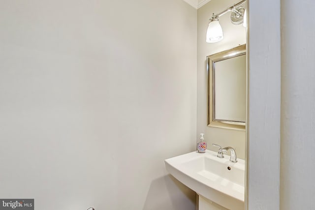 9009 Marie Ct, Lorton, VA 22079 - bathroom featuring a sink and ornamental molding