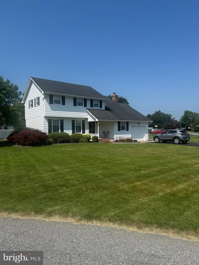1909 Kings Rd, Vineland, NJ 08361 - view of front of property featuring a chimney, a front yard, and a garage