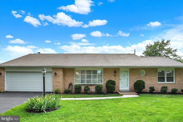 528 Fairway Dr, Camp Hill, PA 17011 - view of front of home featuring brick siding, driveway, a front lawn, and a garage