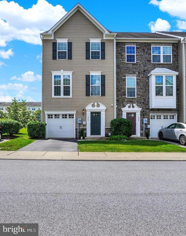 1260 Rannoch Ln, York, PA 17403 - multi unit property with stone siding, a garage, and driveway