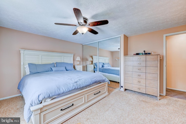 169 Independence Dr, Morrisville, PA 19067 - bedroom with light carpet, a textured ceiling, a closet, and ceiling fan