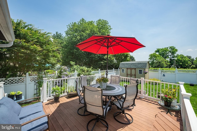 169 Independence Dr, Morrisville, PA 19067 - deck with outdoor dining space, a shed, and a fenced backyard