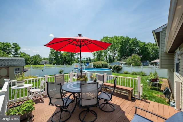 169 Independence Dr, Morrisville, PA 19067 - deck featuring a storage unit, a fenced backyard, and outdoor dining area