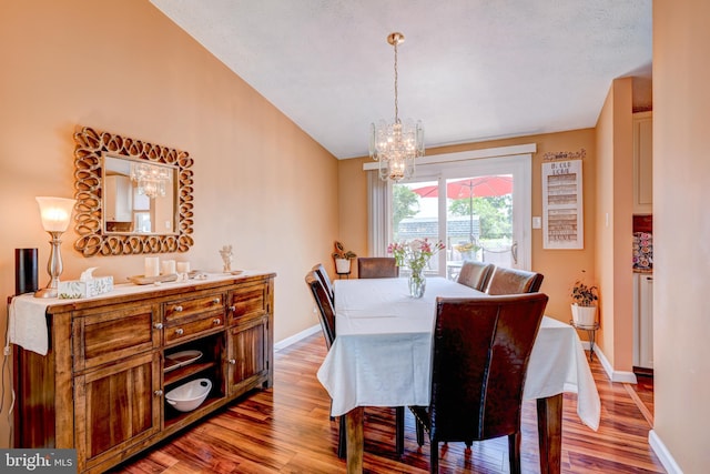 169 Independence Dr, Morrisville, PA 19067 - dining area with light wood finished floors, a chandelier, and vaulted ceiling