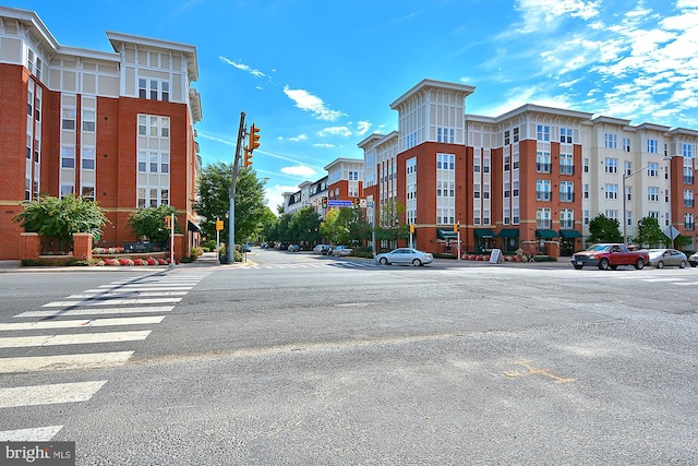 2655 Prosperity Ave Unit 100, Fairfax, VA 22031 - view of asphalt road with street lights, sidewalks, traffic signs, and curbs