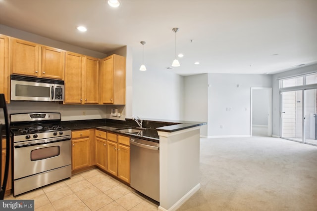 2655 Prosperity Ave Unit 100, Fairfax, VA 22031 - kitchen featuring appliances with stainless steel finishes, open floor plan, recessed lighting, a peninsula, and pendant lighting