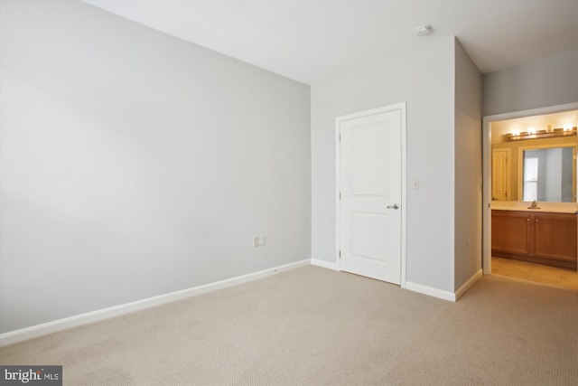 2655 Prosperity Ave Unit 100, Fairfax, VA 22031 - unfurnished bedroom with light carpet and ensuite bath