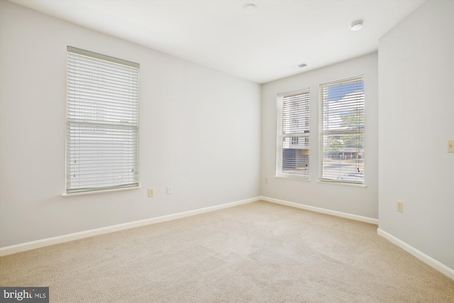 2655 Prosperity Ave Unit 100, Fairfax, VA 22031 - carpeted spare room featuring baseboards and a smoke detector