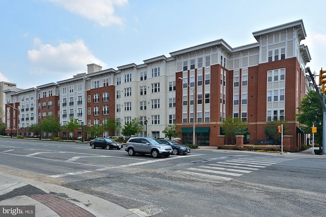 2655 Prosperity Ave Unit 100, Fairfax, VA 22031 - view of building exterior with uncovered parking