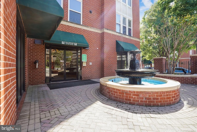 2655 Prosperity Ave Unit 100, Fairfax, VA 22031 - property entrance featuring french doors and brick siding