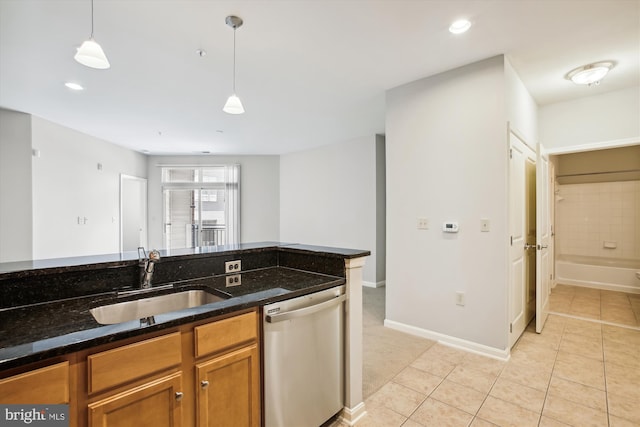 2655 Prosperity Ave Unit 100, Fairfax, VA 22031 - kitchen with stainless steel dishwasher, pendant lighting, brown cabinetry, dark stone countertops, and recessed lighting