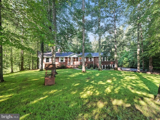 7491 Slagle Ln, Manassas, VA 20111 - view of front facade with a front lawn and brick siding